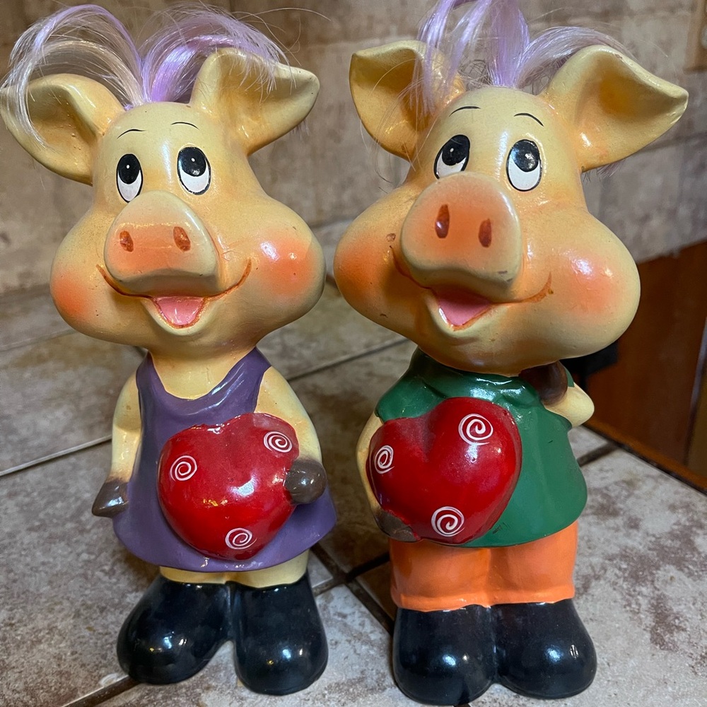 Cute Piglet Figurines with Red Heart - Purple and Green outfits.